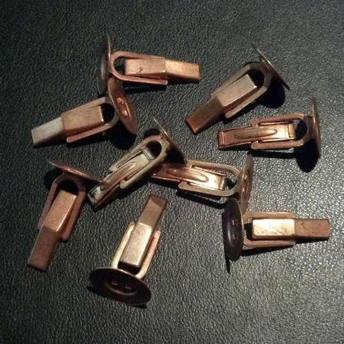Collection of copper cufflink backs