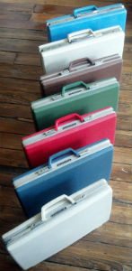 Row Of Seven Vintage Samsonite Briefcases Seven briefcases in a row vertically