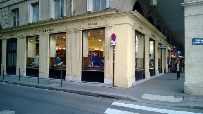 Exterior of Hilditch & Key's Paris shop with parisian street sign 