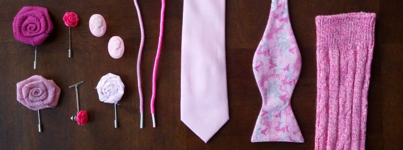Pink men's accessories including lapel flower and bow tie