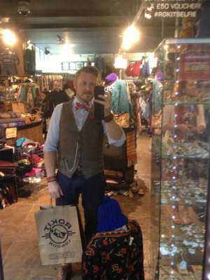 Man in dapper oufit and alber chain 