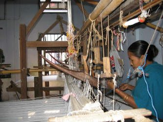 An Assamese weaver at work.