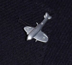 Spitfire plane lapel pin Spitfire plane lapel pin on navy jacket lapel