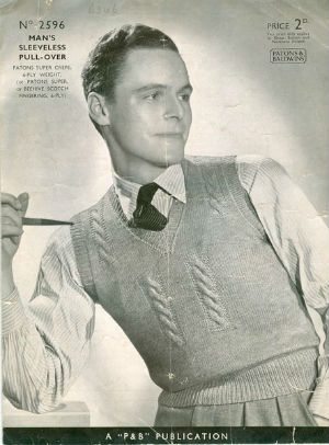 Man holding pipe, in sweater vest. Vintage Photo