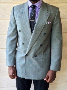 Man wearing double-breasted blazer purchased at thrift shop.