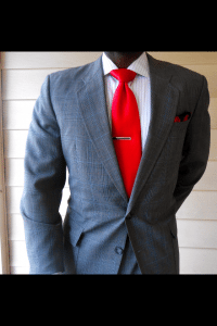 Gerald wearing a suit and tie that he purchased at a thrift store.