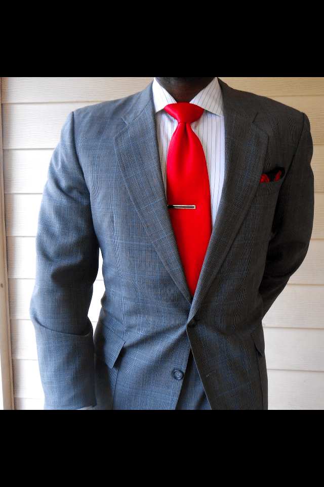 Gerald wearing a suit and tie that he purchased at a thrift store.