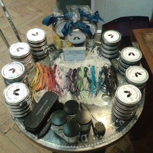 Collection of shoe polish, shoe brushes, and laces