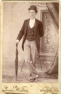 Vintage photograph of man with bowler hat and umbrella