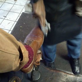 Brown shoes getting polished