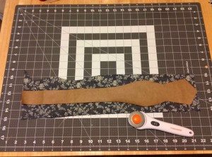 Paper bow tie pattern template over cloth