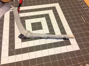 Tip of bow tie emerging from opening