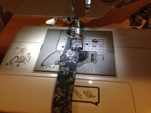 Bow tie middle section opening being sewn closed