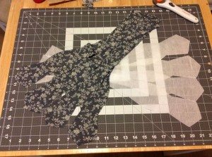 Interfacing pieces alongside cloth patterns