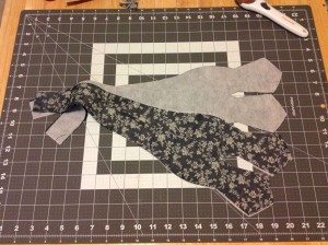 Cutting mat with four interfaced bow tie pattern pieces