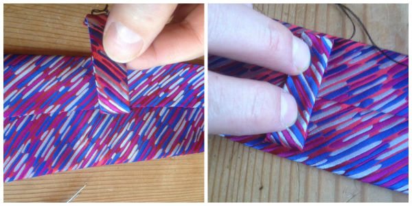 Tie loop being sewn back on