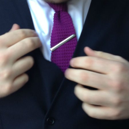 Tie bar incorrectly worn with waistcoat vest