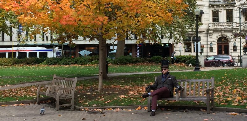 Well dressed man on Philadelphia park bench