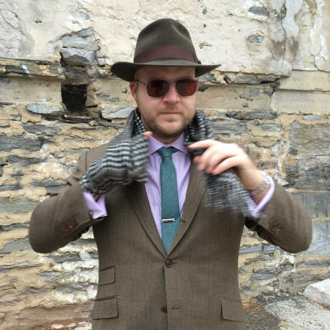 Putting on check wool scarf