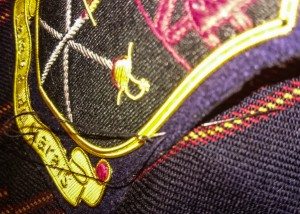 sewing blazer badge on breast pocket
