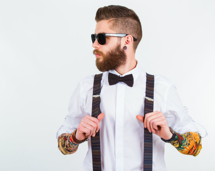 Tattooed man in hipster glasses
