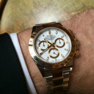 Gold Bezel Gold Rolex Dayton With Globe Backdrop