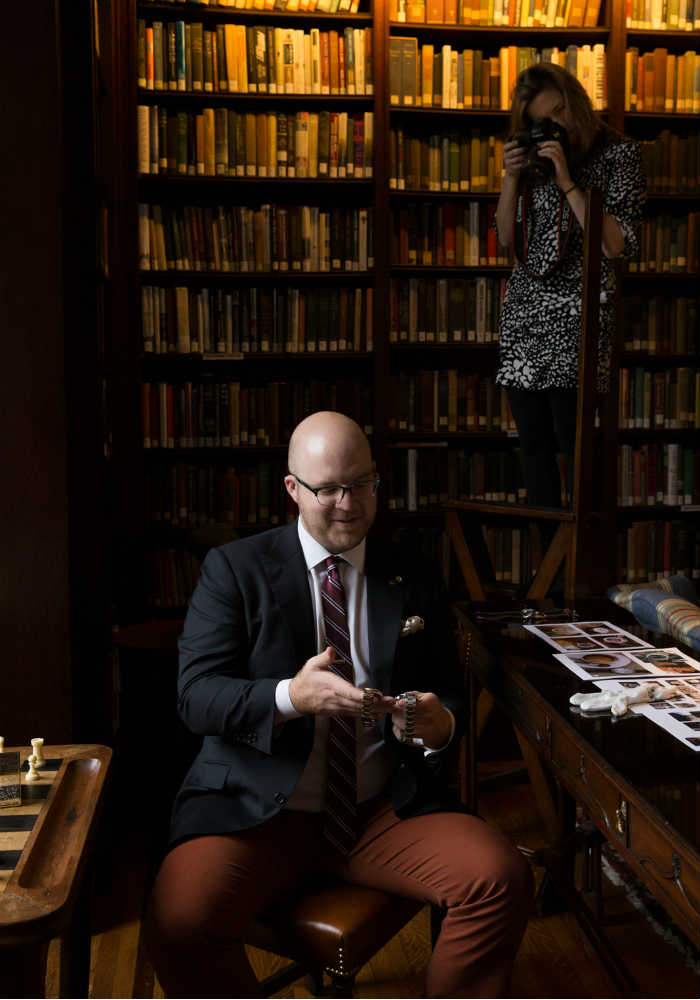 Over the shoulder shot of two Rolexs