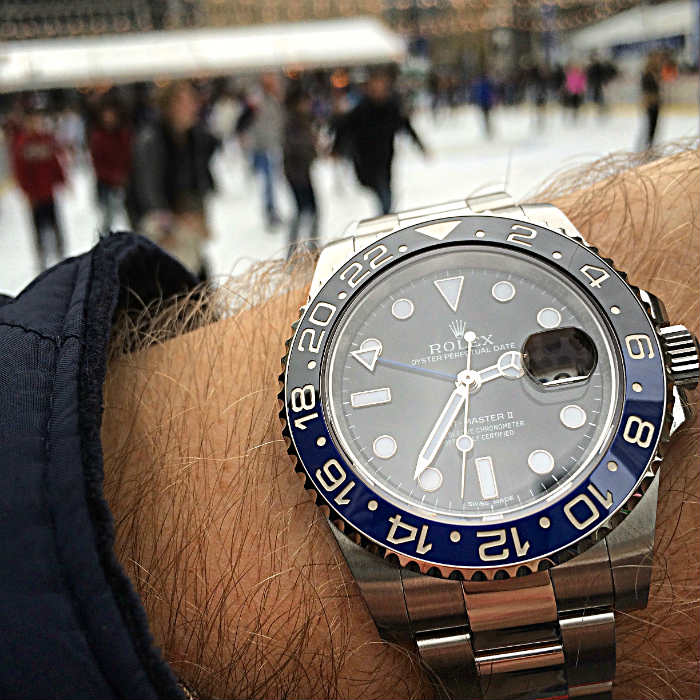 Rolex Batman On The Wrist Over Loooking Ice RInk
