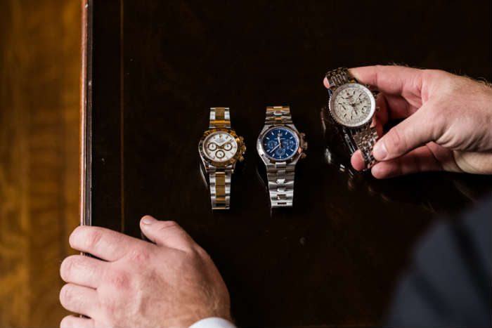 Three mens chronograph watches Rolex Vacheron and Breitling