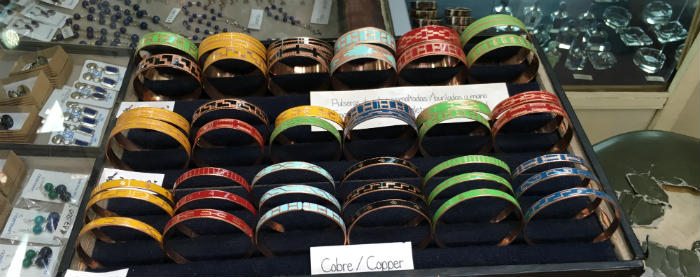 Selection of colorful engraved copper bracelets