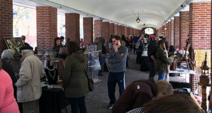 Busy market scene of people and vendors
