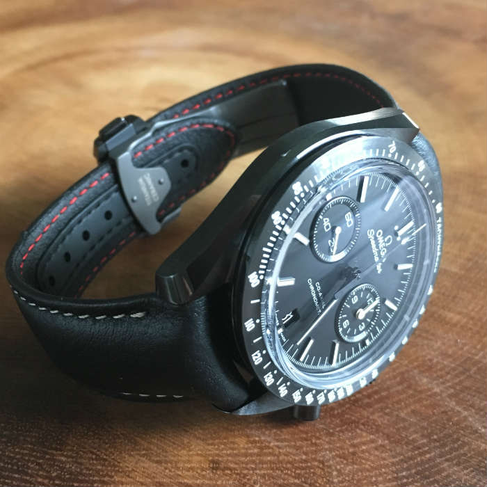 Omega Pitch Black Watch Face Up Close To Side