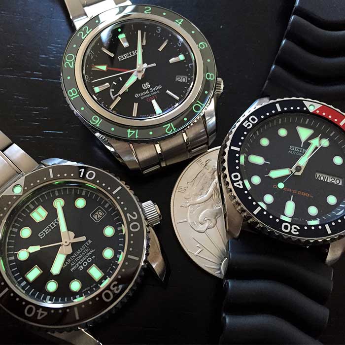 Grand Seiko GMt and Two Seiko SKXs