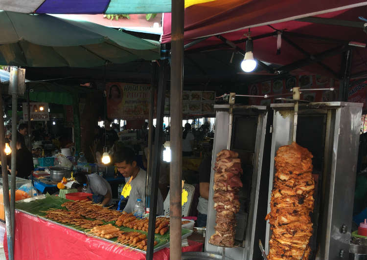 Meat being cooked at Bangkok market