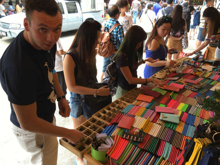 Trevor Guilday looking over passport cover options