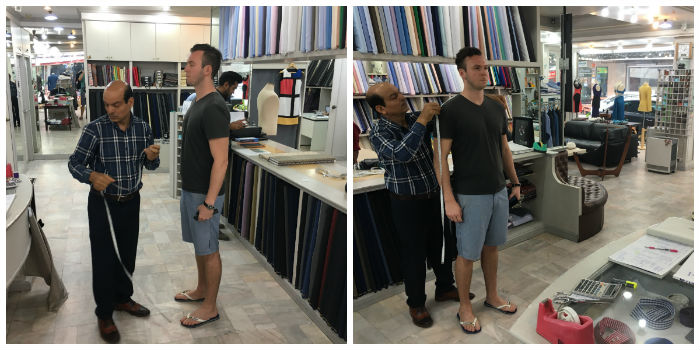 Getting measure for suit at Magnifique Tailors