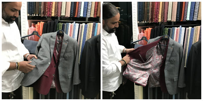 Pater of Suit Master holding bespoke suit