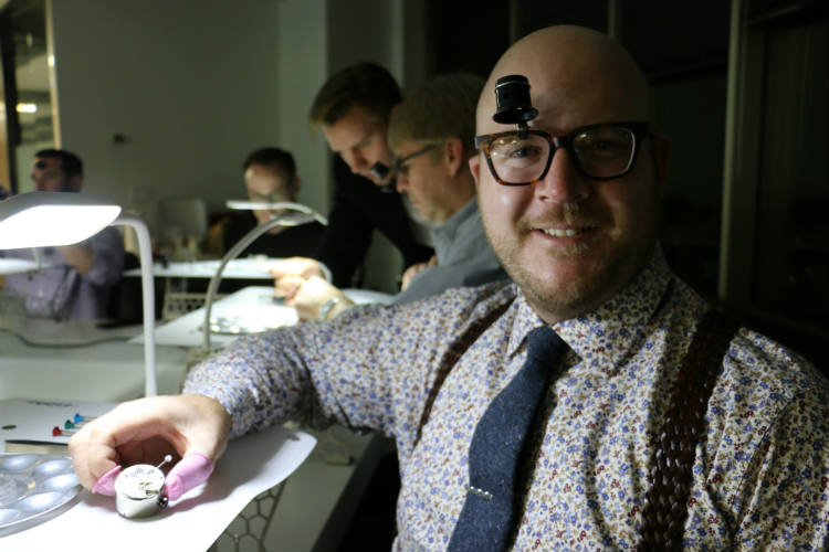 Paul Anthony holding re-assembled ETA movement