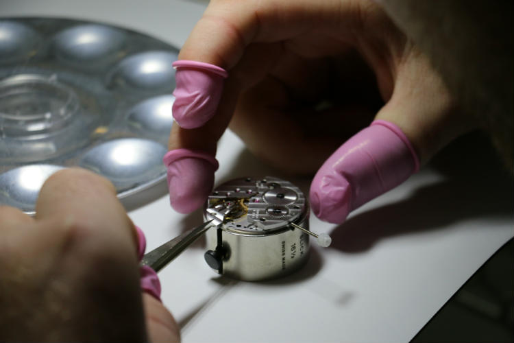Paul Anthony installing balance wheel into watch movement