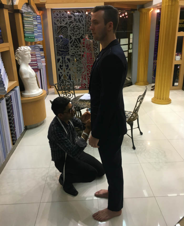 Silhouette of Trevor Guilday in Navy Blue Suit