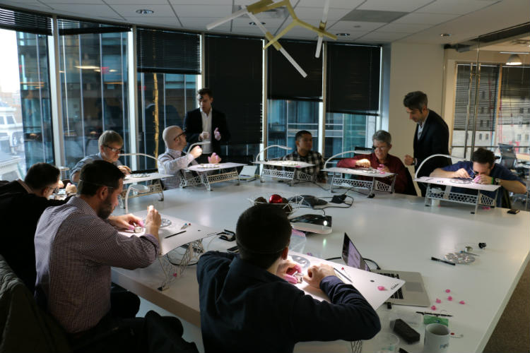 Steve Eagle helping Paul Anthony with watch