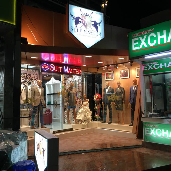 Suit Master shopfront at night