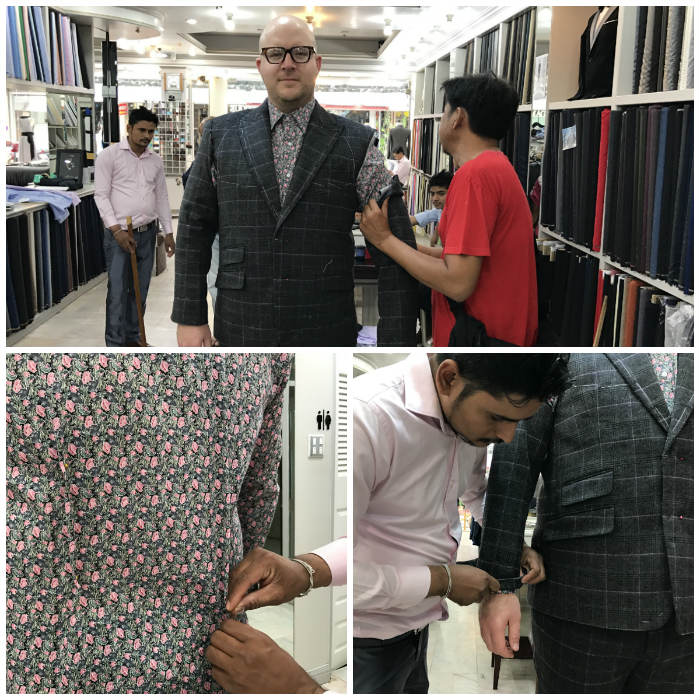 Tailor attaching suit sleeve and darting shirt