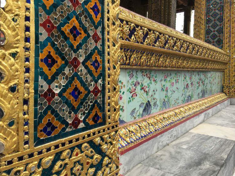 Detailed mosaic design on Thai temple walls