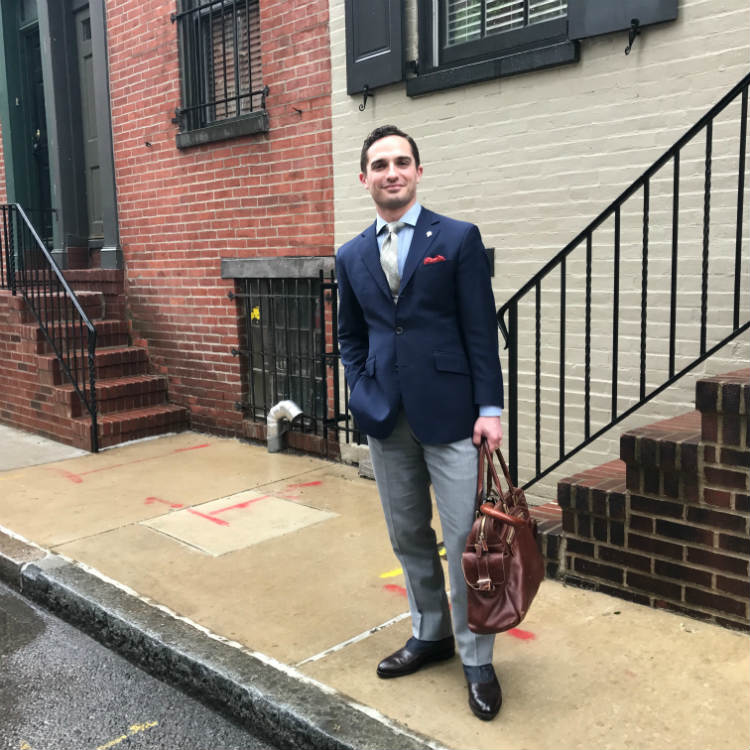 Man In Blue Blazer And Grey Pants