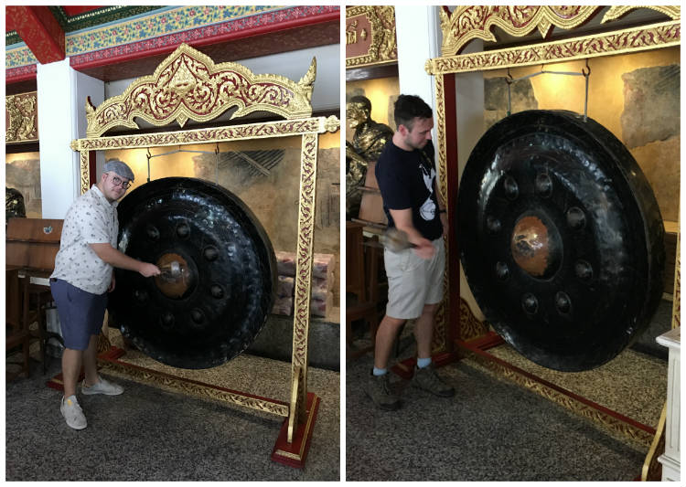 Striking A Large Gong In Wat Pho