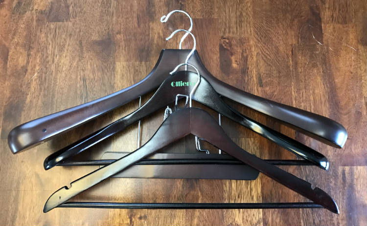 Three mens wooden suit hangers