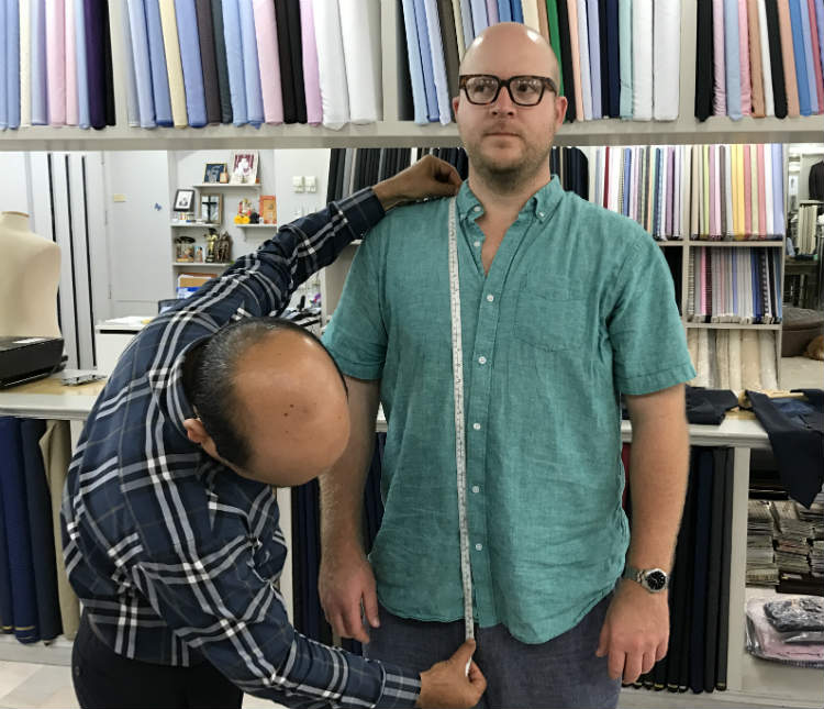 Taking front of suit jacket measurment