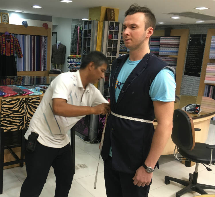 Trevor Guilday getting first bespoke suit fitting