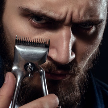 A Bearded Man Holding Vintage Hair Clippers July 2017